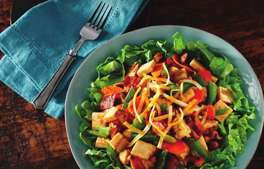 Chipotle Chicken Salad 1. Toss the lettuce, carrots, snap peas and green onions in a large bowl. 2. Add olive oil and toss to coat. 3. Top with crumbled bacon, chipotle chicken and cheese.