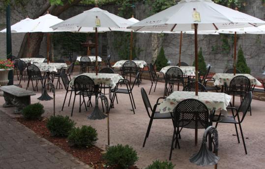 Patio Tables may be configured in different arrangements. There is a portable bar available with limited drink selections. Capacity is 65 for a sit down dinner and 80 for an appetizer party.
