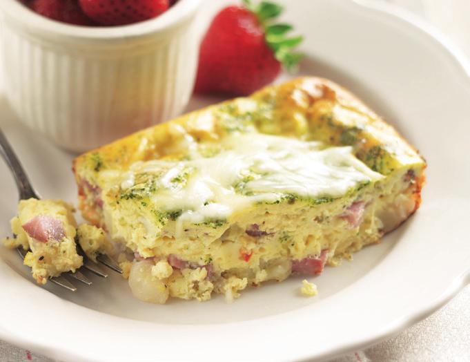 Ham & Swiss Crustless Quiche 8 large eggs 1 packet Artichoke & Spinach Warm Dip Mix ½ cup sour cream 1 cup frozen diced potatoes 1 (8 ounce) package diced ham (1½ cups) 1½ cups shredded Swiss cheese,