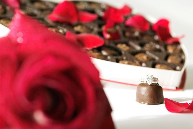 Here are three suggestions: Strategically place clear glass vases of wrapped Lindt Lindor Truffles. They can be placed as centerpieces, at the bar or buffet, or right next to the cake.