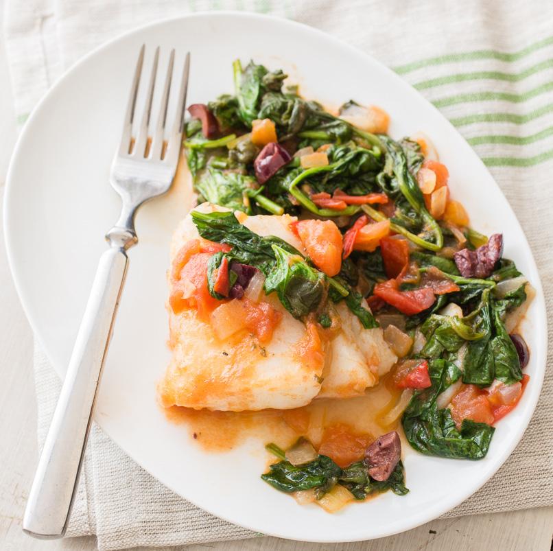 FISH WITH SPINACH COOK TIME: 30 minutes MAKES: 4 servings INGREDIENTS: 3 teaspoons vegetable oil 1 pound skinless cod fillets* 1 yellow onion, peeled, chopped 2 garlic cloves, peeled, minced 2 cups