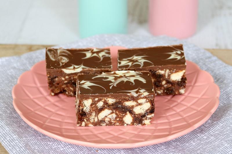HEDGEHOG SLICE 250g packet plain sweet biscuits 130g butter, chopped into cubes 130g dark chocolate, roughly chopped 1 cup sultanas 150g sweetened condensed milk 250g milk chocolate 9. 10.