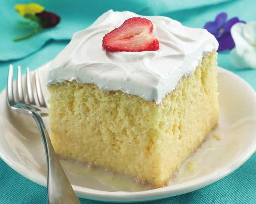 4 In large bowl, stir together sweetened condensed milk, whole milk and whipping cream. Carefully pour evenly over top of cake.