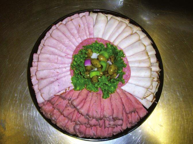 sliced meats Our meat tray is piled high with thin, freshly sliced ham, oven roasted turkey breast and