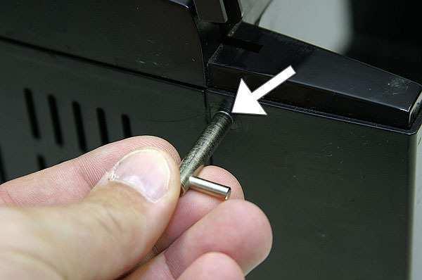 3. Unscrew the oval head screw gently without causing any