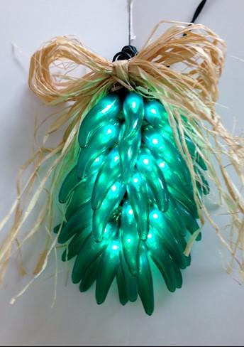 Green Ristra Item number: 53MG Try a tradition of the southwest with one of our lighted chili ristras, complete with a raffia bow and a raffia hook for hanging.