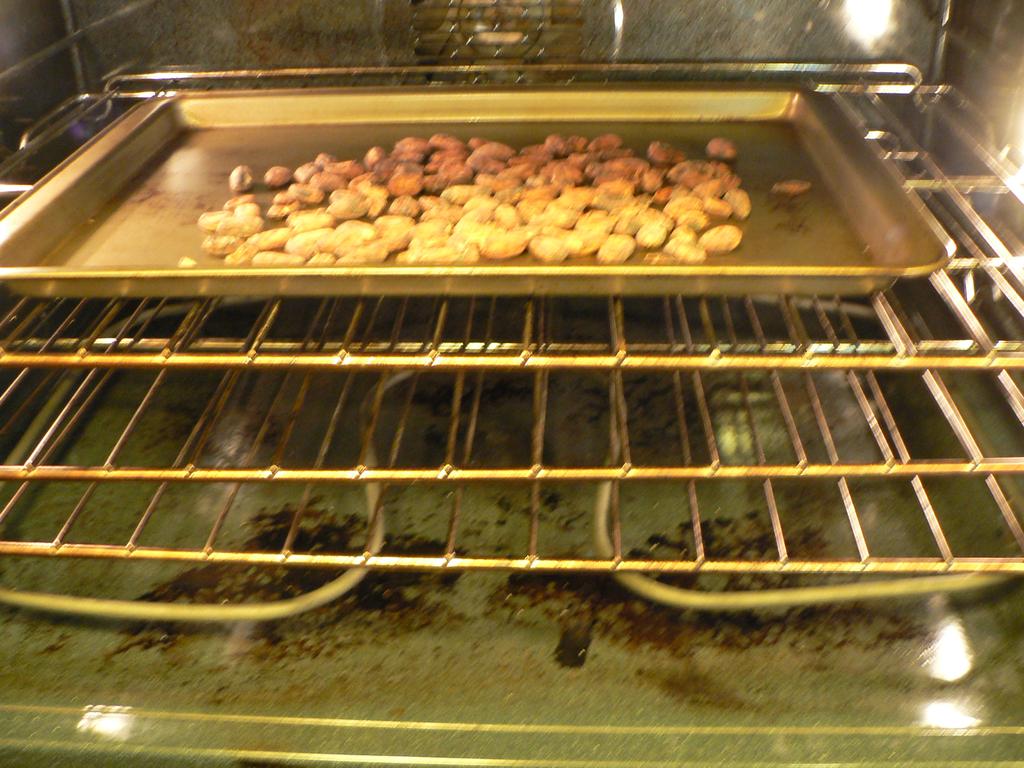Figure 3: Roasting beans in oven and forefingers), puffiness of the shell (it should come off easily), and taste (it should be crunchy, not chewy and should not taste raw or nutlike).
