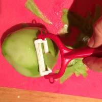 Peel the chayote like you would an apple.
