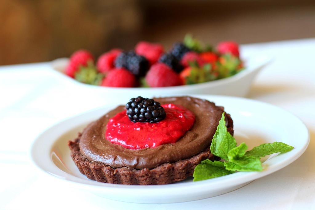 SUPERFOOD BERRY CHOCOLATE TARTS Rich chocolate crème filling surrounded by flaky chocolate crust and topped with a sweet