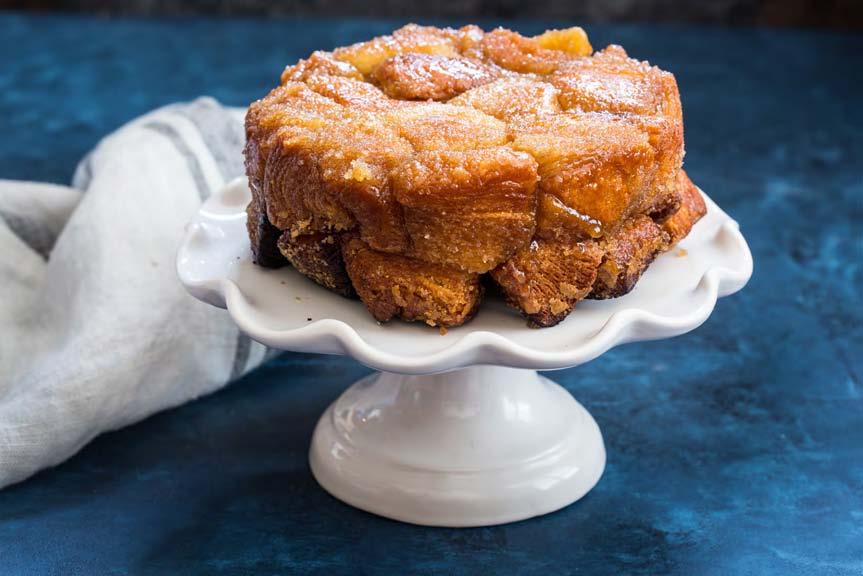 DESSERTS Sweet Monkey Bread SERVES 4-6 Cut the biscuits into quarters and toss in a bowl or plastic bag with the cinnamon and sugar and toss to coat completely.