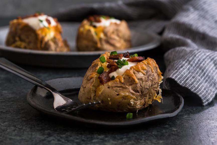 APPETIZERS Loaded Baked Potatoes SERVES 4 Scrub your potatoes and prick all over with the tines of a fork. Place in the basket of your air fryer and press the potato setting at 350 degrees.