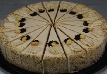 We begin with a dark chocolate cake, separated and topped with layers of our own fabulous coconut pecan filling, and
