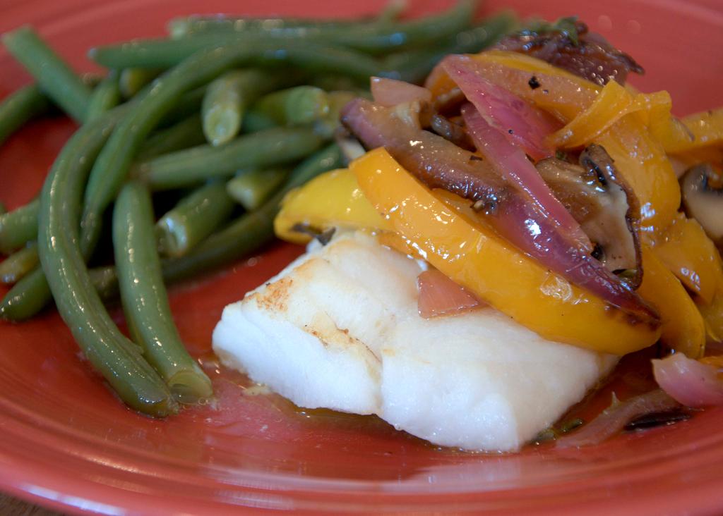 Ingredients: 1 fillet fish per person (salmon, cod, halibut or other types work) 1/2 c butter, melted 3 TB bacon grease or coconut oil 6 bell peppers, julienned 1 small red onion 1 bunch oregano 1 lb