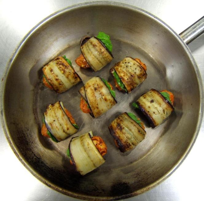 soft and lightly coloured Assemlage: lay out the roasted eggplant slices garnish with two basil leafs and one slice of Gruyere cheese set one tomato wedge on top and sprinkle with the fresh oregano