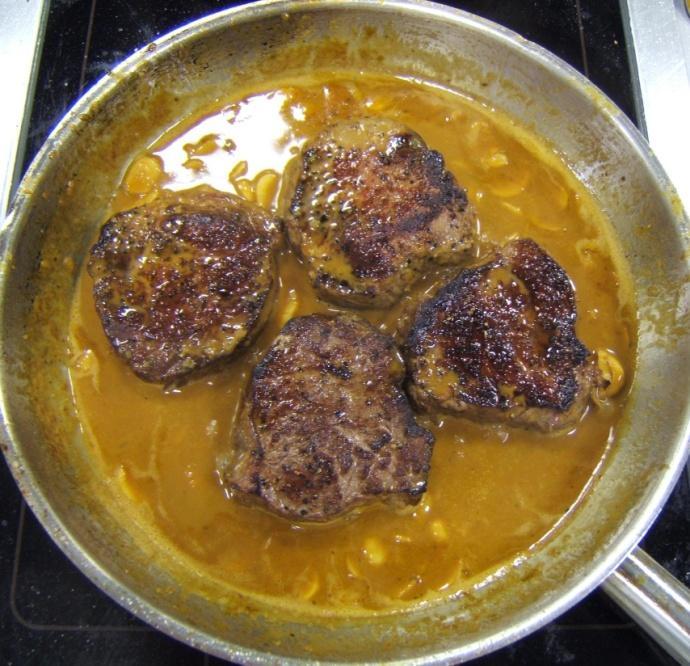 the sauce, turn them several times to coat them ladle the hot brandy over the steak and ignite with a