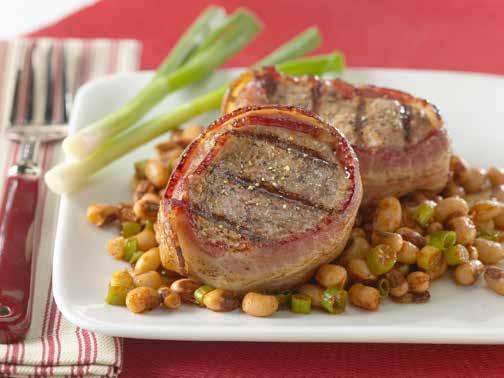 BACON- WRAPPED PORK TENDERLOIN WITH TEXAS CAVIAR 15 20 6 Calories: 480, Protein: 43g, Fat: 21g, Sodium: 940mg, Cholesterol: 105mg, Saturated Fat: 7g, Carbohydrates: 25g Fiber: 7g.
