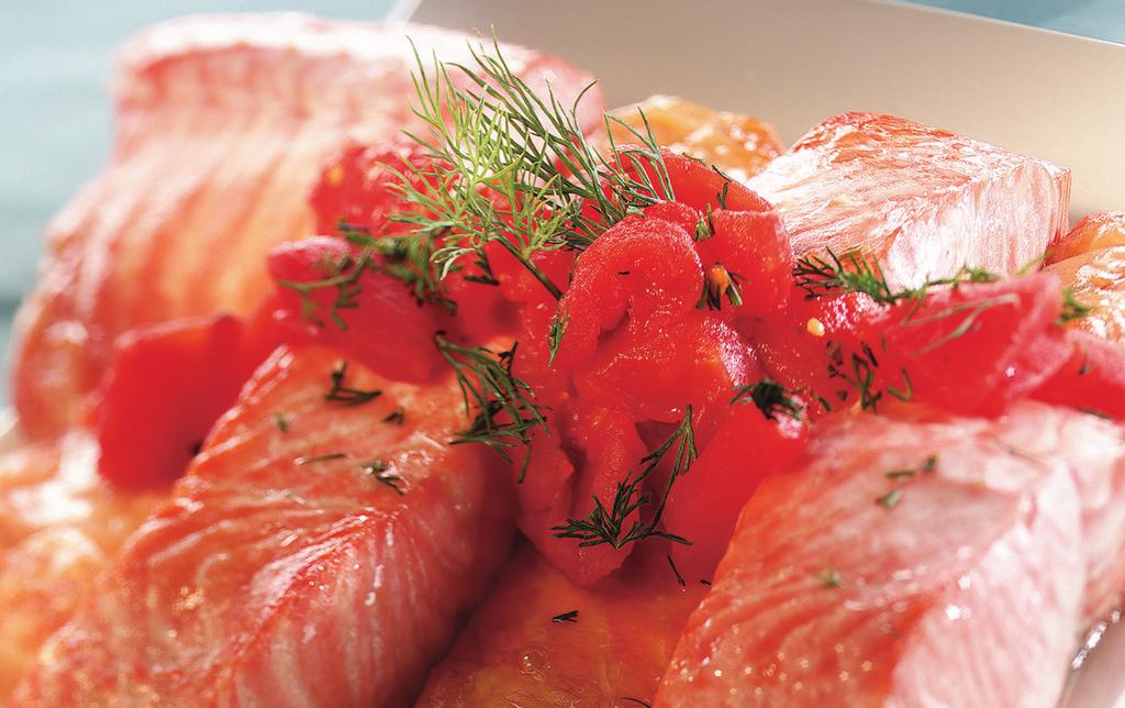 SALMON WITH DILLED TOMATOES MAKES 4 SERVINGS 1 (14 oz) can Italian-style diced tomatoes 1/4 cup finely chopped fresh dill weed 1 tsp minced garlic 4 (6 oz) salmon fillets, 1 inch thick 1.