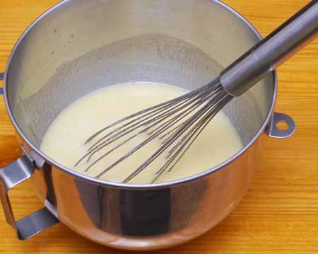 3 3 Add the eggs, pineapple juice, remaining sugar, ginger, and vanilla extract to the bowl and mix well.
