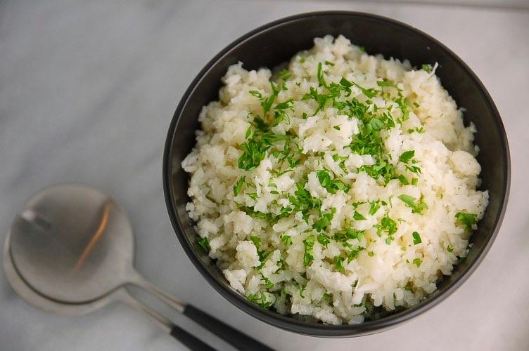 CAULIFLOWER RICE WHEN CHOPPED FINELY, CAULIFLOWER BECOMES A BLANK CANVAS READY FOR SOME ADVENTUROUS SEASONING. CONSIDER SOY SAUCE+GINGER+LIME JUICE OR CUMIN+CILANTRO+LEMON JUICE.