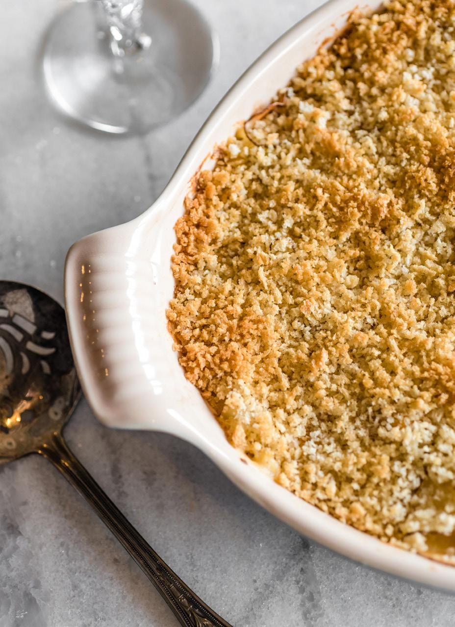 Cheesy Au Gratin Potatoes Serves: 4-6 1 small onion, chopped 1 clove garlic, minced 5 tablespoons butter, divided 2 large russet potatoes 1 tablespoon all-purpose flour 1/2 teaspoon ground mustard