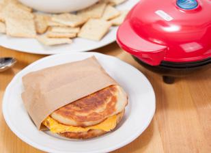 Place sandwich inside the Mini Maker Griddle and cook until cheese is melted and the bread is toasted. DIRECTIONS Toast English muffin in Mini Maker Griddle. Then, cook sausage patty.