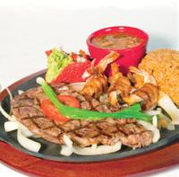 99 * STEAK A LA MEXICANA 10 oz. Rib Eye steak topped with onions, tomatoes, jalapeños and cilantro. 16.99 Served with rice, beans, pico de gallo and tortillas.