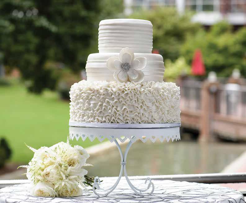 Ruffles Romantic ruffles and luster dusted fondant bands and a broche embellished bloom create this stylish masterpiece.