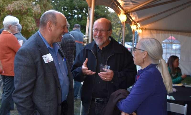 Oregon Seed Council Executive Director, Roger Beyer (left), shares time