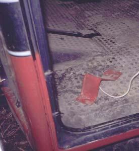 Fig. 17. A foot pedal override on a mechanical pruning device that can stop or reverse the action of the cutter bars. Oxley Farm, Lawton, Michigan.
