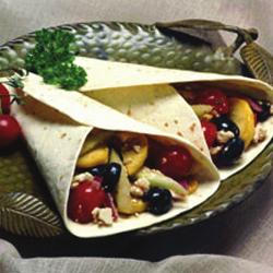 Greek Wrap 4 10-inch wheat or whole wheat tortillas ¾ cup crumbled feta cheese 16 cherry and/or yellow pear tomatoes, halved 10 extra-large black olives, drained, halved ½ medium red onion, thinly