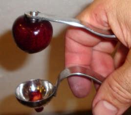 then releasing your grip, the cherry rides up on the metal stem, while the pit remains trapped in the cup, stuck in