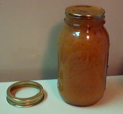 If it pops up and down (oen making a popping sound), it is not sealed. If you put the jar in the refrigerator right away, you can still use it.