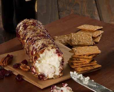 2. Brush goat cheese all over with maple mustard and coat with pecan and cranberry mixture,
