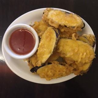 95 Fried crab cake with sweet and sour sauce.