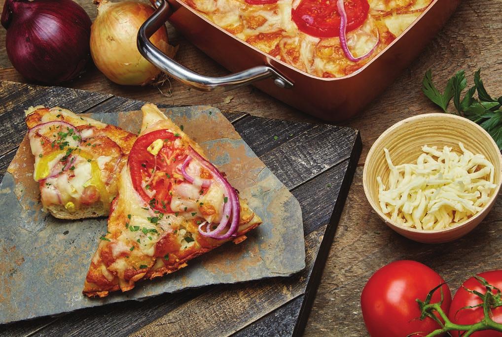 Focaccia 1 lb. pizza dough 1 tomato, sliced ½ red onion, peeled and sliced ½ cup mozzarella, shredded ½ yellow pepper, sliced into rings 3 Tbsp. grated Parmigiano cheese 2 Tbsp. olive oil 1.