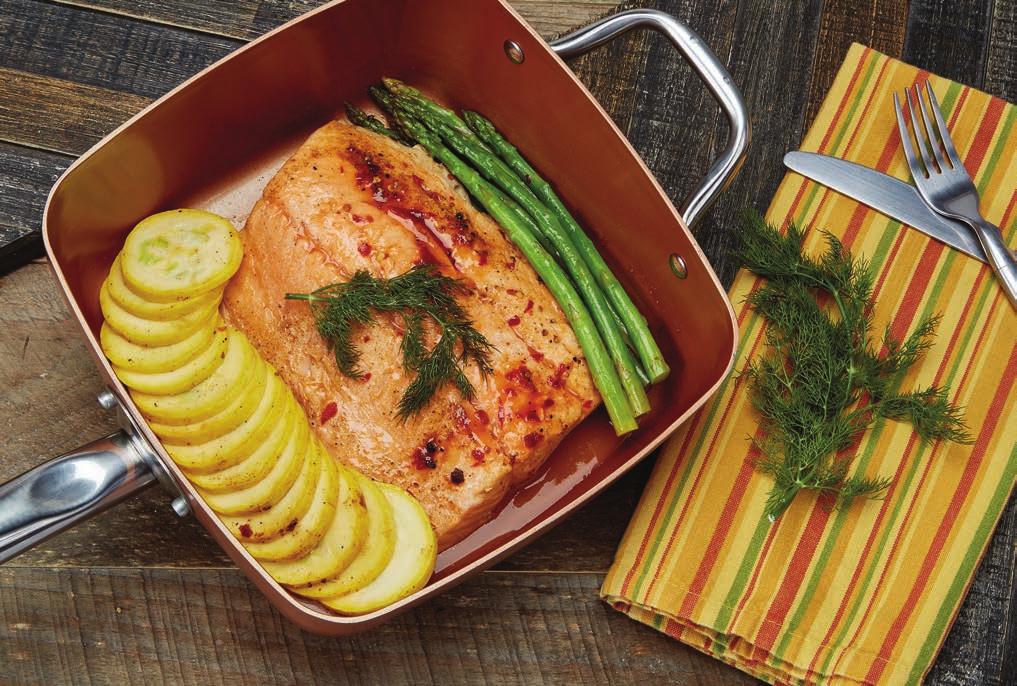 Salmon 2 lb. salmon, with skin salt & pepper 10 pc asparagus, cleaned 1 yellow squash, sliced 2 Tbsp. sweet chili sauce 3 Tbsp. white wine 1. Preheat the Copper Chef pan for 4 minutes on medium heat.