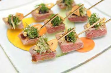 enjoy champagne and passed hors d oeuvres at the reception Seared Toro with Garlic Crisps, Shiso,