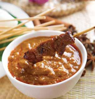 Satay with peanut sauce Ingredients of Thai tom yam soup black pepper, candlenut, cinnamon, coriander, lemongrass, shallot, tamarind and turmeric from India; and garlic, ginger and scallions from