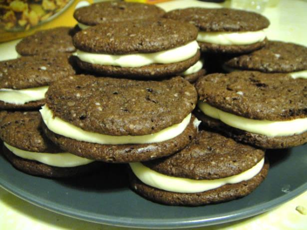 Sandwich Cream Cookies Cookies: 1 package devil s food cake mix ¼ cup butter 2 eggs Icing: 1 8 oz pck cream cheese ¼ cup butter 2 cups powdered sugar 1 ½ tsp vanilla