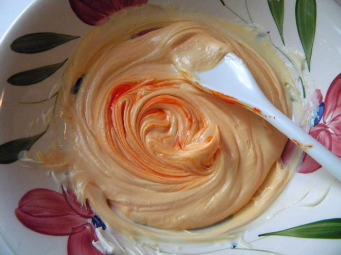 To that, add your water-based food coloring. Orange or mix yellow and red to make orange.
