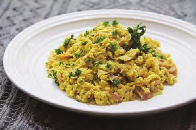 When the ham is crispy and sweet potatoes are soft, add cumin and stir. Add the eggs, season with salt and pepper and scramble until eggs are cooked through. Serve topped with the parsley.