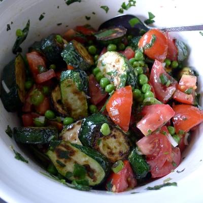Courgette Salad Serves: 4 500g Courgettes, sliced 2 Red Peppers, chopped 2 Yellow Peppers, chopped 2 tbsp Olive Oil 200g Feta, cubed 2 Spring Onions, finely chopped 50g frozen Peas, defrosted 150g