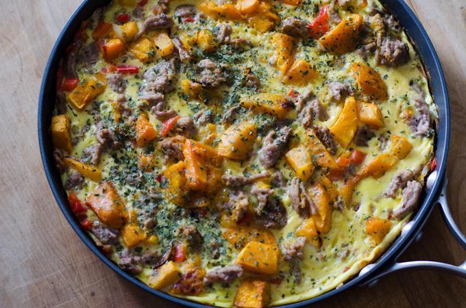 SAUSAGE AND BUTTERNUT SQUASH FRITTATA 1 tablespoon bacon fat, duck fat, or fat of choice 3 ounces cooked sausage, chopped or crumbled ¼ cup onion, diced ¼ cup red pepper, diced ½ cup butternut