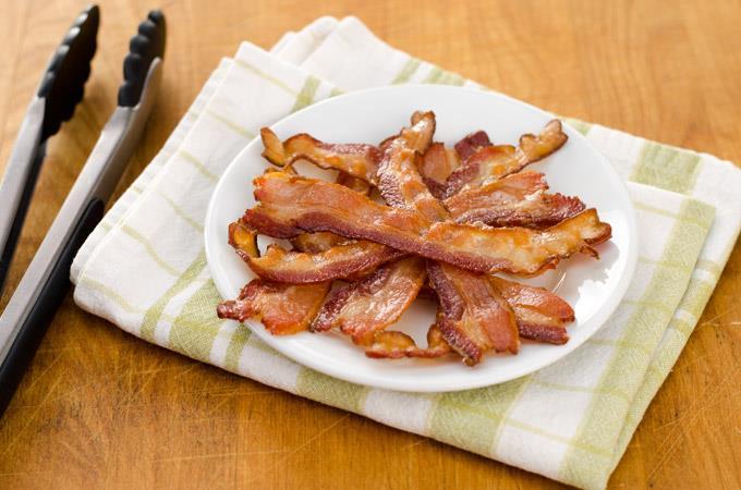 HOW TO COOK BACON IN THE OVEN 8-10 slices gluten free bacon 8-10 slices 1. Line a rimmed baking sheet with foil and arrange the bacon slices on it leaving a little space in between each slice.