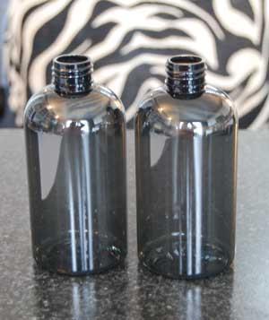 Sizes available: 8 oz, 4 oz, 2 oz, and 1 oz. Sold in cases of 10. 8 oz. crystal black PET Boston round bottles.