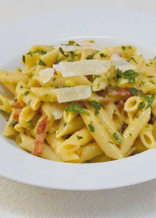 Penne Carbonara ½ pound (230 g) bacon sliced into ½-inch (1 cm) pieces 2 tablespoons olive oil 2 cloves garlic, minced 4 cups (950 ml) dry penne (uncooked) 1½ cups (135 g) grated Parmesan cheese,