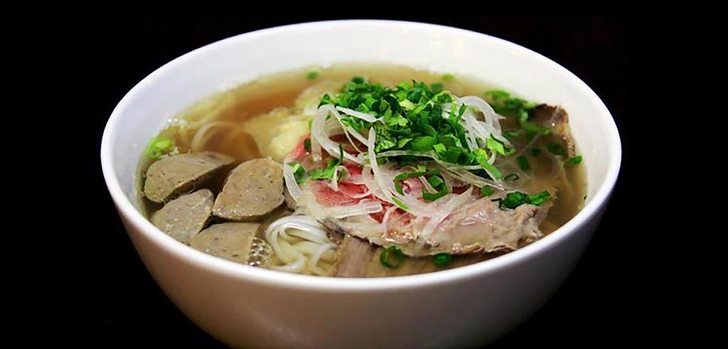 VIETNAMESE PHÓ Aromatic Beef Broth with Rice Noodle topped with White Onions, Green Onions, Cilantro and serviced with a side of fresh Herbs DAC BIET / SPECIAL COMBO...11.