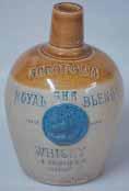 GRANTS 2 9ins tall, with handle, Art Nouveau Floral Pattern, raised letters on shield GRANT S LIQUEUR Royal Doulton pm, Very 33.