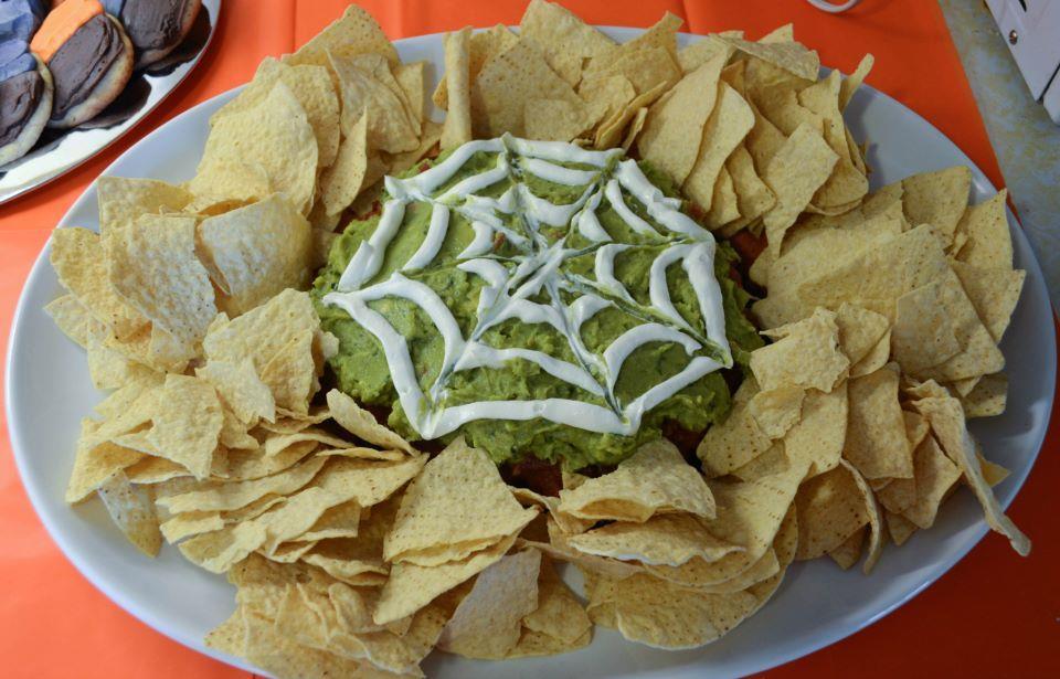 Spiderweb Dip Make multilayer dip on a plate ending with guacamole as the top layer.