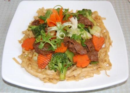 Soft-Noodles - Mì xào mềm A pan fried soft egg noodle containing mixed vegetables (carrot, broccoli, mushroom, baby bokchoy, baby corn, and